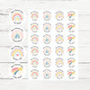 Sheet of round pastel rainbow teacher stickers with praise phrases on white wood background