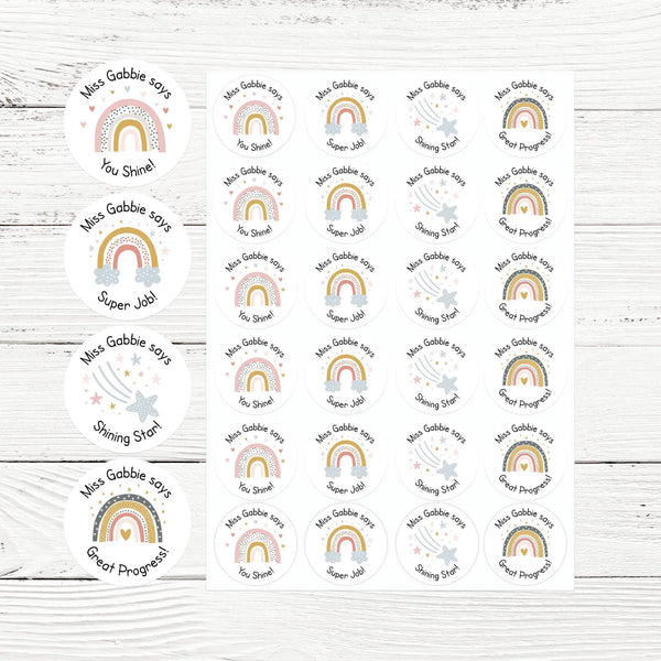 Sheet of round personalised teacher stickers with rainbows, stars, and encouragement phrases.