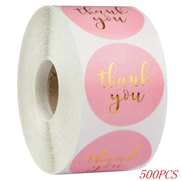 roll of stickers on a roll pink with Gold foil text